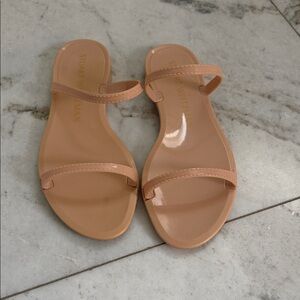 Stuart Weitzman Patent Slide Sandals in Nude/Tan